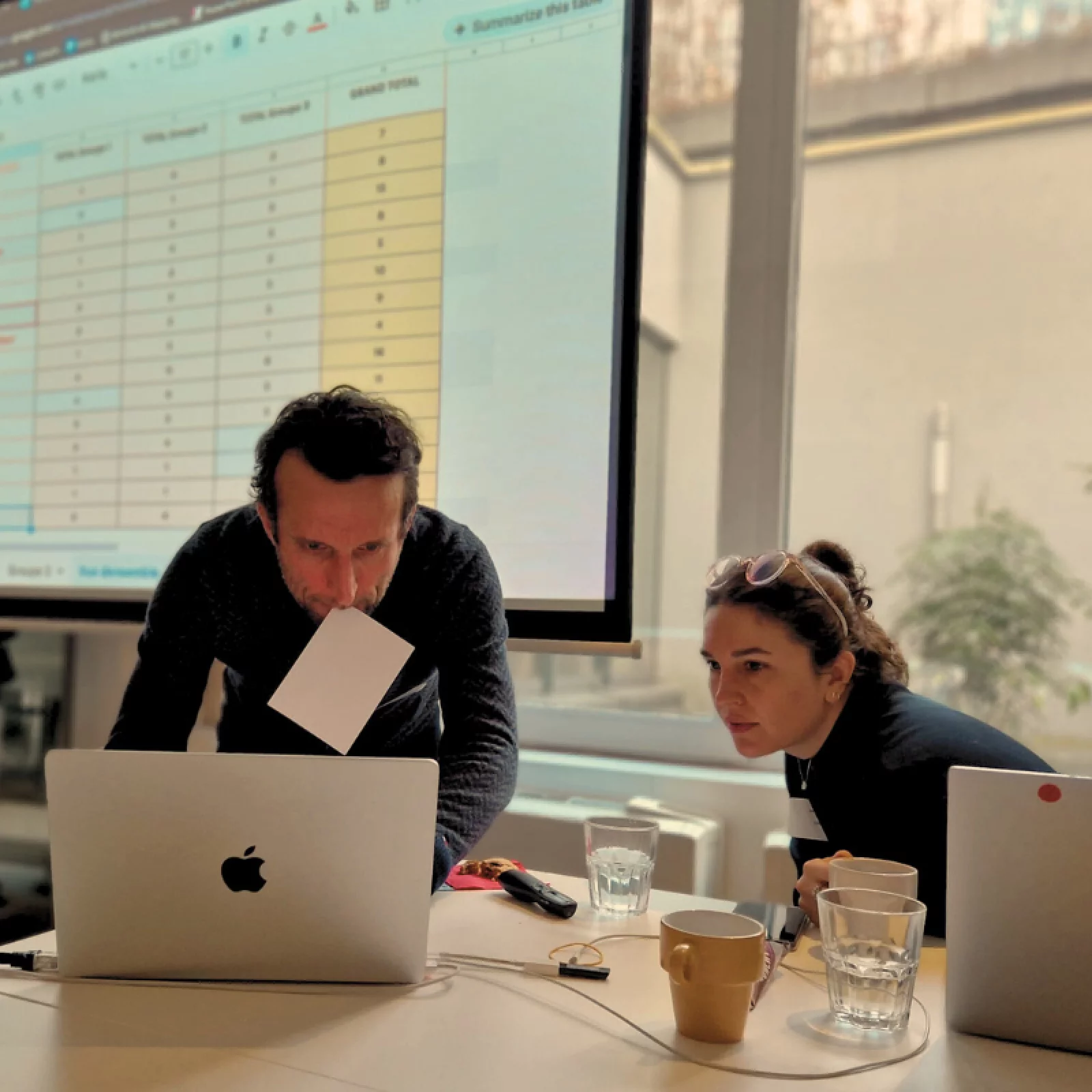 Team members collaborating on sustainability projects